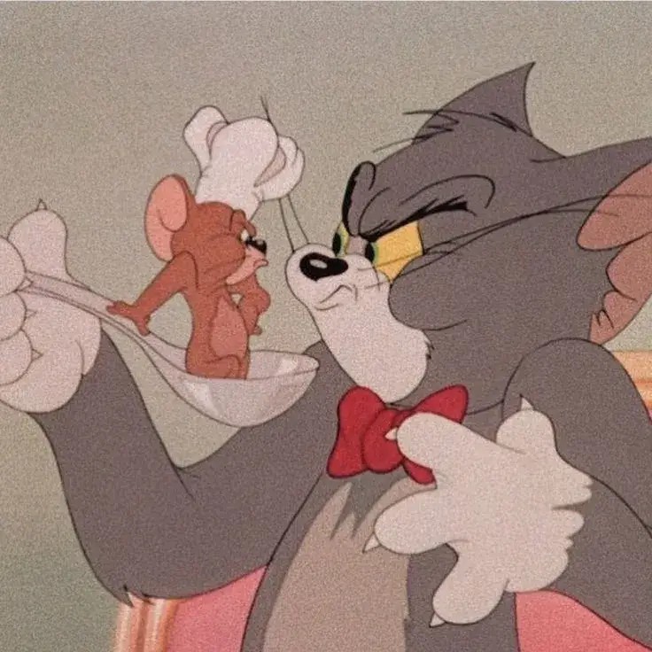 Jerry bị mèo Tom bắt được